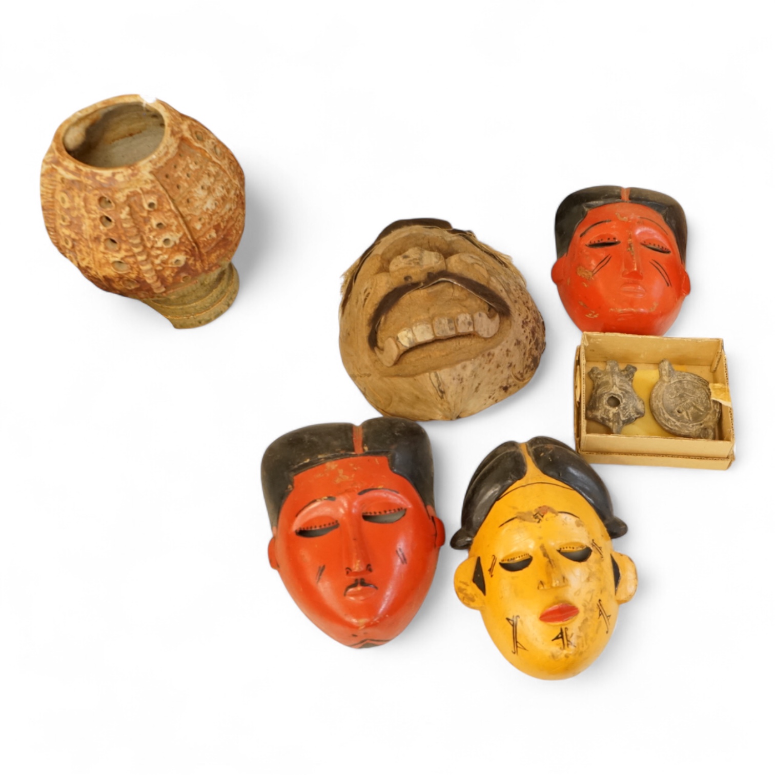 Four Japanese masks, two small oil lamps and a framed batik-16.5high x 19cm wide